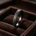Close-up of minimalist matte black starry sky titanium steel ring with fine glitter. - Size 5 / 4mm / Black