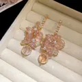 Macro detail of elegant champagne crystal tassel earrings with zircon and pearl accents - 80# Crystal Bead Pearl Tassel Style / Silver Earring Post Style / Gold-Pink