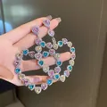 Funkelnde Herz-Ohrhänger mit bunten Kristallen und Zirkonia in einem süßen, eleganten Stil. - Strass Herz Stil / bunt