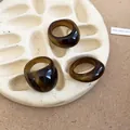 Detailed macro shot of dark amber geometric resin rings showing translucent texture - Amber Brown Marbled Style (8#)