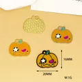 Detailed view of Halloween pumpkin enamel charms with 16mm height and 20mm width - Gold Style / Pumpkin Head