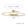 Detail van goudkleurige armband met schroefdraadkralen, verstelbaar 16-22 cm - Armband / 16-21cm