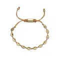 Close-up of gold stainless steel coffee bean link bracelet with adjustable cord closure - Woven Cord Adjustable Bracelet / Gold