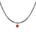 Detail view of a minimalist necklace with grey cube beads and a vibrant red bead pendant. - Round Bead Style