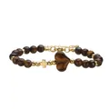 Detailaufnahme eines Tigerauge-Perlenarmbands mit Herzstein und goldfarbenem Kreuzanhänger. - Tigerauge Stein Armband