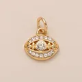 Close-up of a gold-plated evil eye pendant encrusted with sparkly clear crystals for DIY jewelry. - Eye Pendant