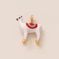 Detailed macro view of a white llama animal charm with colorful saddle and gold hooves - Alpaca Pendant