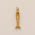 Close-up of a 18K gold-plated stainless steel fish charm featuring a unique red eye - No.8 Big Tail Fish