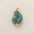 Detailed macro view of a blue ceramic nautilus shell pendant with gold-plated bail - 30 Blue Conch