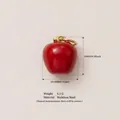 Detailed view of a red apple pendant accessory with stainless steel material and dimensions - Red Apple Pendant / Pendant Only (No Chain)