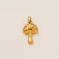 Detailed close-up of a gold mushroom charm with embossed polka dots for jewelry - Mushroom Pendant