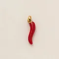 Macro detail view of a vibrant red enamel chili pepper charm with polished gold ring - Red Chili Pendant