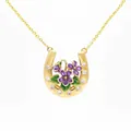 Detailed view of a gold-toned horseshoe necklace featuring purple violet flowers and crystals. - February Violet Horseshoe Necklace