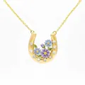 Detailed view of a gold-plated horseshoe necklace with enamel flowers and crystals - September Aster Horseshoe Necklace