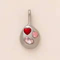 Macro view of organic stainless steel pendant featuring red heart and pink gem stones - Colorful Rhinestone Irregular Pendant / Steel