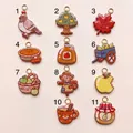 Vue détaillée de onze pendentifs originaux en émail sur le thème de l'automne pour bijoux - Pendentif Colombe