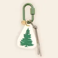 Detail view of a handcrafted pine tree bag charm with a green carabiner and cord - Pine Tree