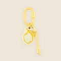 Detailed close-up of a hand-drawn lemon keychain pendant with yellow carabiner - Lemon