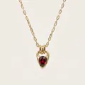 Detail view of a teardrop red zircon necklace with 18K gold plating and horseshoe clasp - Red