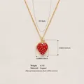 Gold-plated strawberry pendant necklace in copper with red enamel finish - Strawberry Locket / Gold