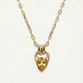 Detailed macro view of gold plated necklace with teardrop yellow zircon and horseshoe bail - Gold Yellow