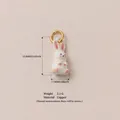 Detailed white cartoon rabbit jewelry charm with gold-plated copper ring and dimensions - Bunny Pendant
