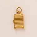 Gold suitcase-shaped necklace pendant with characteristic horizontal ridge design - Luggage