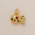 Macro view of gold-plated fish pendant featuring colorful enamel dots and a sparkling crystal - Colorful Fish