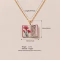 Elegant vintage copper book necklace featuring a detailed January flower pendant design - January Carnation Book Necklace