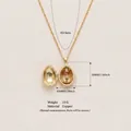 Vintage copper egg locket necklace opening to reveal a miniature nutcracker figure pendant - Deep Red Egg (Soldier)