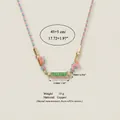Detailed close-up view of a colorful braided necklace with a Happy engraved copper pendant. - HAPPY DREAM