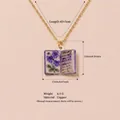 Vintage February book necklace with purple floral design and copper pendant - February Violet Book Necklace
