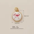 Round gold-plated copper pendant featuring a red ribbon bow pattern with oil-dripped finish - Pendant 16 Bowknot