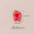 Dettaglio pendente dente cuore smalto rosa con dimensioni 16,5 mm x 12,5 mm - Forma di Dente Cuore