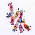 Set of nine colorful fish-shaped pendants with leopard spots and cute cat fruit motifs. - 1-Strawberry Fish Pendant