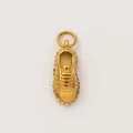 Close-up of golden sneaker charm pendant with sparkling rhinestone details - Sneaker Shape Pendant / Gold