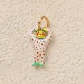 Cute character charm pendant featuring red polka dots and yellow face with a golden ring - Muscle Figure Charm / White Polka Dot