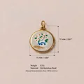 Detailed macro view of round stainless steel flower pendant with 18K gold plating - Large Tree Floral Style (No. 4) / 17x15mm / Gold