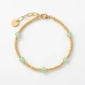 Detail of vintage gold beaded bracelet with faceted light green stones and lobster clasp - Beaded Tag Style / Gold / Turquoise