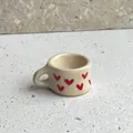 Miniature cream-colored ceramic style cup pendant featuring cute red heart prints for DIY jewelry - Heart Cup Pendant