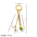 Gold-tone keychain with wine glass, cloud and green beaded charms, weighs 15.5g - Wine Glass Charm