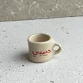 Exquisite miniature ceramic-style mug pendant featuring red Habibi Arabic script design - Habibi Cup Pendant