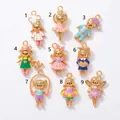 Detail view showing nine unique colorful enamel cartoon girl charms in various outfits. - Cartoon Chef Doll Pendant (MTPK262115OI) / Colorful