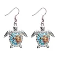 Dettaglio orecchini a tartaruga argentati con strass blu e accento in oro rosa - Orecchini Tartaruga / Oro