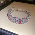 Vista detallada de pulsera vintage con circonitas ovales rosas y rojas y detalles turquesas. - Pulsera / Plateado-Rosa-Azul-Rosa Rojo