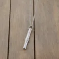 Detailed view of a silver titanium steel whistle pendant necklace for anxiety relief - Rotating Bead Steel Slim Waist Necklace