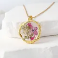 Elegant resin pendant necklace featuring real pink and white dried flowers - February