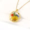 Gold-plated round necklace with real pressed yellow and blue flowers in resin pendant - October