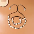 Set collana e bracciale con conchiglie di ciprea fatte a mano con cordino nero per spiaggia - Set Intrecciato / Nero