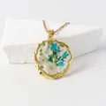 Handmade resin necklace with real dried blue and white flowers in gold frame - May